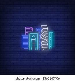 Bright city skyscrapers neon sign. Architecture and downtown design. Night bright neon sign, colorful billboard, light banner. Vector illustration in neon style.