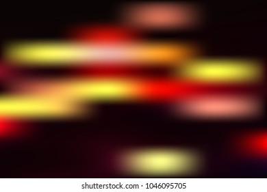 Bright colored blurry spots on a black background.