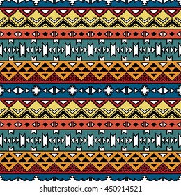 Bright colored seamless pattern in boho chic style. Hand drawn abstract background with aztec motives. Ethnic print template for fabric and paper. Summer fashion.