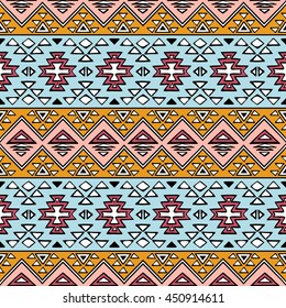 Bright colored seamless pattern in boho chic style. Abstract background with aztec ornament. Hand drawn ethnic print template for fabric and paper. Summer fashion.
