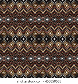 Bright colored seamless pattern in boho chic style. Hand drawn abstract background with aztec motives. Ethnic print template for fabric and paper. Summer fashion.