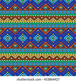 Bright colored seamless pattern in boho chic style. Hand drawn abstract background with aztec motives. Ethnic print template for fabric and paper. Summer fashion.