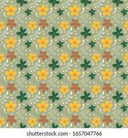Bright colored spring flowers and leaves. Spring flowers on green  background. Spring design perfect for wallpaper, gift paper, spring greeting cards, fabric, textile, web design. Hand-drawn.
