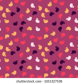 Bright colorful purple seamless pattern with simply cartoon red, orange, pink and violet birds chaotic placed at magenta background. Bright backdrop, print for clothes or wrapping paper
