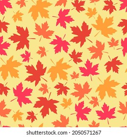 bright colorful seamless pattern with the image of maple leaves.