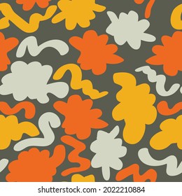 bright colorful spotted seamless pattern. gray, red, yellow spots and wavy stripes are randomly arranged on a khaki background. vector
