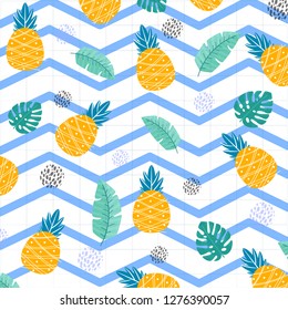 
bright combination of juicy summer pineapple in New Year holidays with green leaves on a white background , monstera 2019