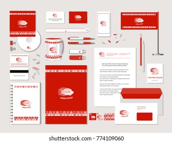 The bright corporate identity with fish and ornaments in ethnic style. Samples of business cards, a disk, a flag, a pen, a flash card, a form, an envelope, a mug, a notepad, a pencil. Vector.