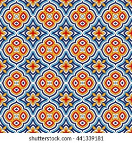 Bright ethnic abstract background. Seamless pattern with symmetric geometric ornament. Ornamental vivid wallpaper. Vector illustration