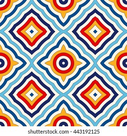 Bright ethnic abstract background. Seamless pattern with symmetric geometric ornament. Ornamental vivid wallpaper. Vector illustration