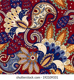 Bright ethnic seamless pattern. Colorful indonesian batik. Wallpaper with decorative flowers and Paisley. Design for textile, fabric, wrapping paper, web, cover