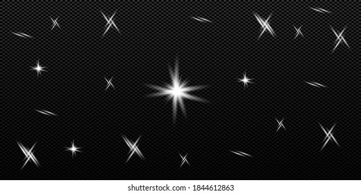 bright flash of light glare of a star shimmers with rays on a black background