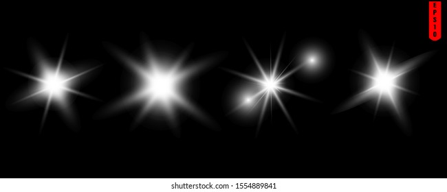 Bright flash, set of vector sun flares on a black background.