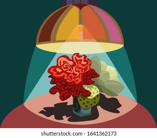 Bright flowers in a vase under a cozy lampshade in the living room