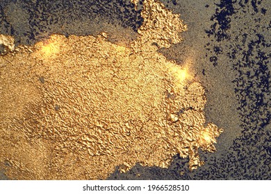 Bright gold and dark blue pattern with texture of geode and sparkles. Abstract vector background in alcohol ink technique. Modern paint with glitter. Template for banner, poster design. Fluid art