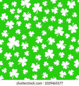 Bright green clover leaves, seamless pattern. Minimal vector background. Flat illustration of clover icon. St Patrick's background.