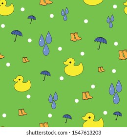 Bright green seamless background pattern with yellow ducks and blue umbrellas