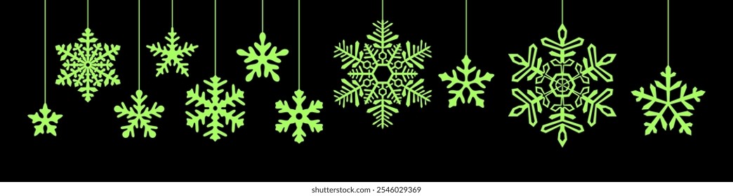 Bright green snowflakes hanging elegantly against a dark background, creating a striking contrast perfect for festive and seasonal design themes.