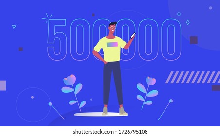 bright guy on a blue background looks at the smartphone and rejoices in winning