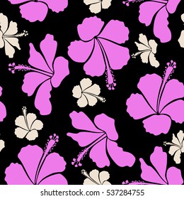 Bright hawaiian seamless pattern with tropical hibiscus flowers on black background in beige and pink colors.