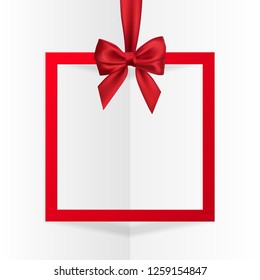 Bright holiday gift box frame banner hanging with red ribbon and silky bow on white background. Vector illustration.