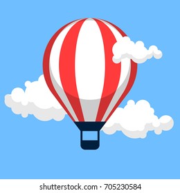 Bright hot air balloon in the clouds. Symbol of travel and freedom.