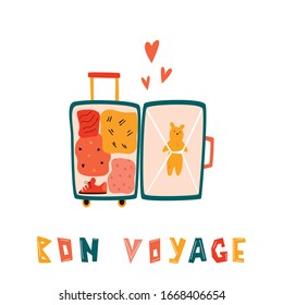 Bright illustration of an open suitcase with different stuff for vacation. Lettering text BON VOYAGE. Vector card in a flat style