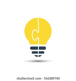 Bright light bulb made of puzzle, vector idea concept.