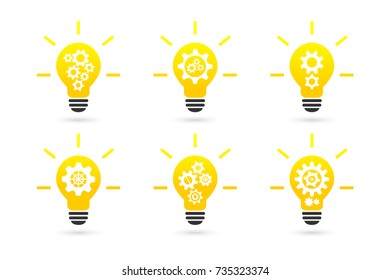 Bright lightbulb with gear wheels concept. Icon set.