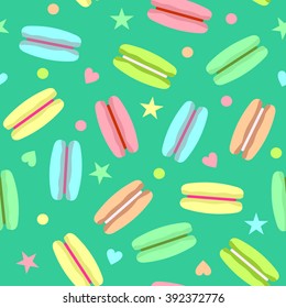Bright macaroons isolated on green background. Seamless pattern with french macaroons, stars and hearts. Delicious sweet macaroons. Can be used for wallpapers, posters, wrapping paper. Vector 