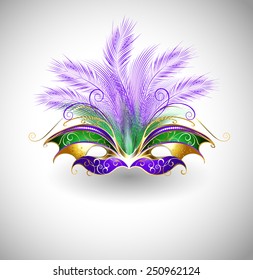 Bright Mardi Gras Mask With Purple And Green Feathers, Decorated With Gold Pattern On Light Background.