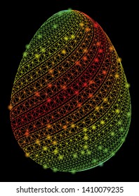 Bright mesh abstract egg with diagonal stripes with glow effect. Shiny wire frame polygonal mesh in vector format on a black background. Abstract 2d mesh built from polygonal grid, dots,