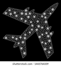 Bright mesh aircraft with glow effect. Shiny wire frame polygonal network in vector format on a black background. Abstract 2d mesh designed with polygonal grid, small circle, glossy light spots.