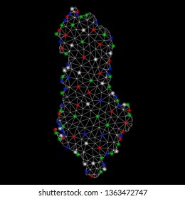 Bright mesh Albania map with glare effect. Wire carcass polygonal mesh in vector format on a black background. Abstract 2d mesh designed with triangular lines, dots, colored flash spots.