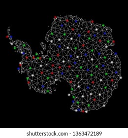 Bright mesh Antarctica map with glare effect. Wire carcass triangular mesh in vector format on a black background. Abstract 2d mesh designed with triangular lines, dots, colorful glare spots.