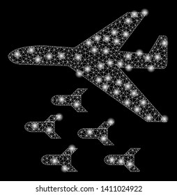 Bright mesh bomber bombs with glare effect. Abstract illuminated model of bomber bombs icon. Shiny wire frame triangular mesh bomber bombs abstraction in vector format on a black background.
