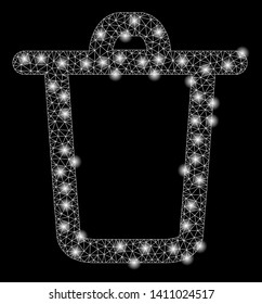Bright mesh bucket with glare effect. Abstract illuminated model of bucket icon. Shiny wire carcass triangular mesh bucket abstraction in vector format on a black background.