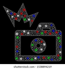 Bright mesh camera flash with glow effect. White wire frame triangular mesh in vector format on a black background. Abstract 2d mesh designed with triangular lines, dots, colored flash spots.