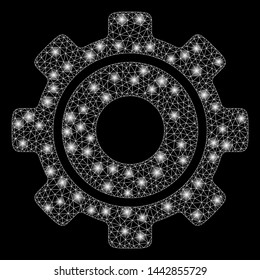 Bright mesh cog with glare effect. Abstract illuminated model of cog icon. Shiny wire carcass polygonal network cog. Vector abstraction on a black background.