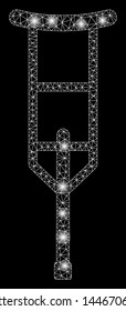 Bright mesh crutch with glare effect. Abstract illuminated model of crutch icon. Shiny wire frame polygonal mesh crutch abstraction in vector format on a black background.