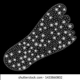Bright mesh foot with glitter effect. Abstract illuminated model of foot icon. Shiny wire carcass triangular mesh foot. Vector abstraction on a black background.