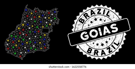 Bright mesh Goias State map with lightspot effect, and rubber print. Wire carcass polygonal Goias State map mesh in vector format on a black background.