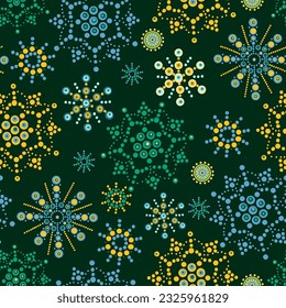 bright multicolored flowers with dots on a green background. abstract seamless wallpaper