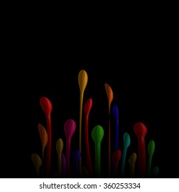 Bright multi-colored paint drops small stream erupts from below on black background.