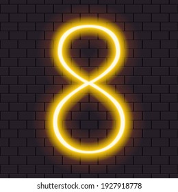 Bright neon yellow number "8" isolated on a dark brick wall.