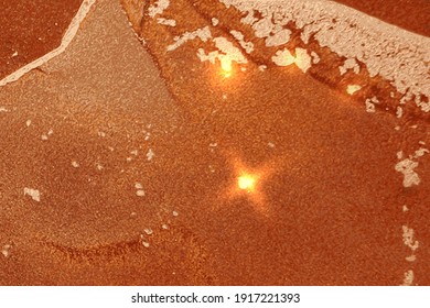 Bright orange and gold marble texture with sparkles. Abstract vector background in alcohol ink technique. Modern paint with glitter. Template for banner, poster design. Fluid art painting