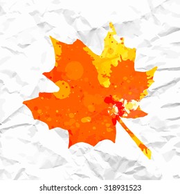 Bright orange watercolor autumn maple leaf over white crumpled paper.