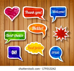 Bright paper-cut speech and thought bubbles on realistic wooden background. Vector illustration.