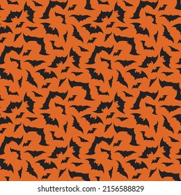 Bright pattern with black bats on an orange background. Halloween festive autumn decoration. October holiday print for paper printing, textile and design. Vector flat illustration