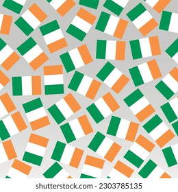 Bright pattern with flags of Ireland. Happy St. Patricks Day background. Bright illustration with irish flag. Seamless pattern with flags.